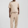 Jogging unisexe en molleton coton beige surteint coupe Relaxed