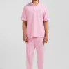 Polo manches courtes unisexe en piqué coton rose surteint coupe Oversized