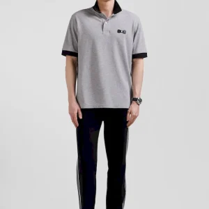 Polo manches courtes en piqué coton noir détails tricolores coupe Oversized