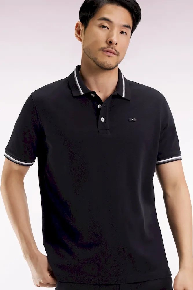 Polo manches courtes en coton noir détails rayés coupe ample