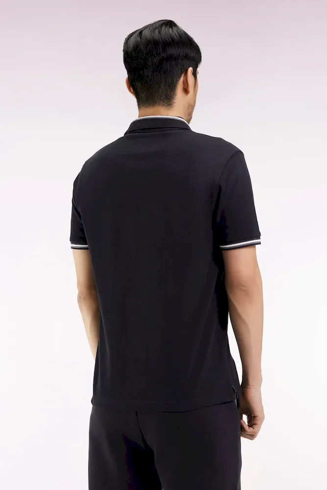 Polo manches courtes en coton noir détails rayés coupe ample – Bild 5