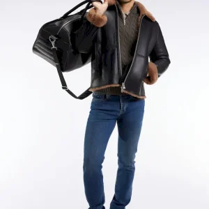 Blouson en peau lainée noir col marron