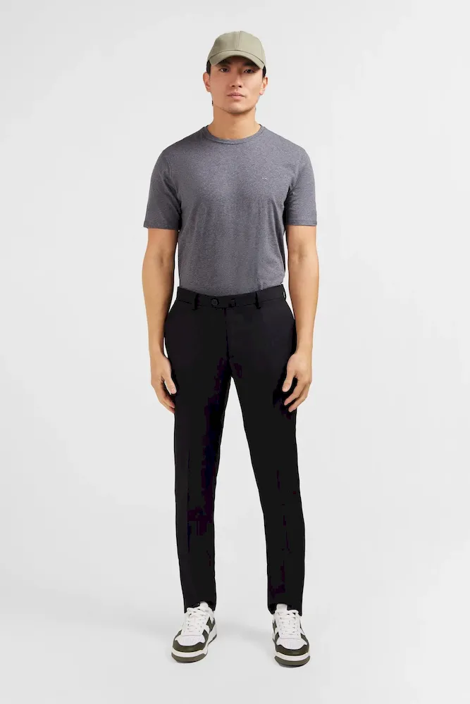 Pantalon slim noir en laine à plis cassés